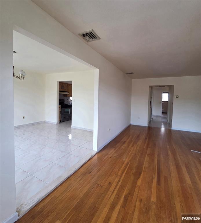 688 Day Avenue, Unit 2 Ridgefield, NJ 07657 - Photo 7 of 18 wooden floor in an empty room