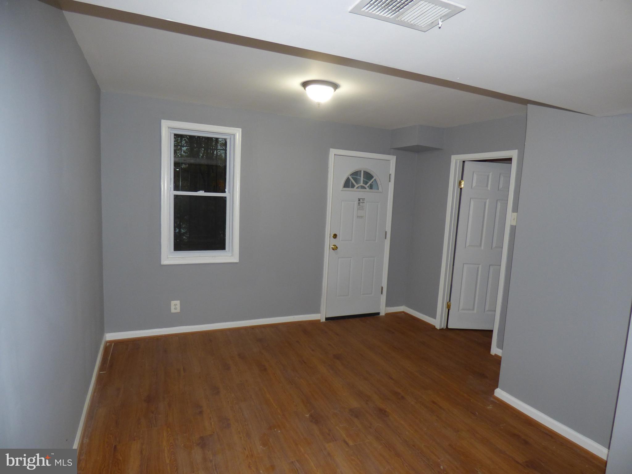 7829 Burnside Road Landover, MD 20785 - Photo 27 of 38 Rear Exit Family Room