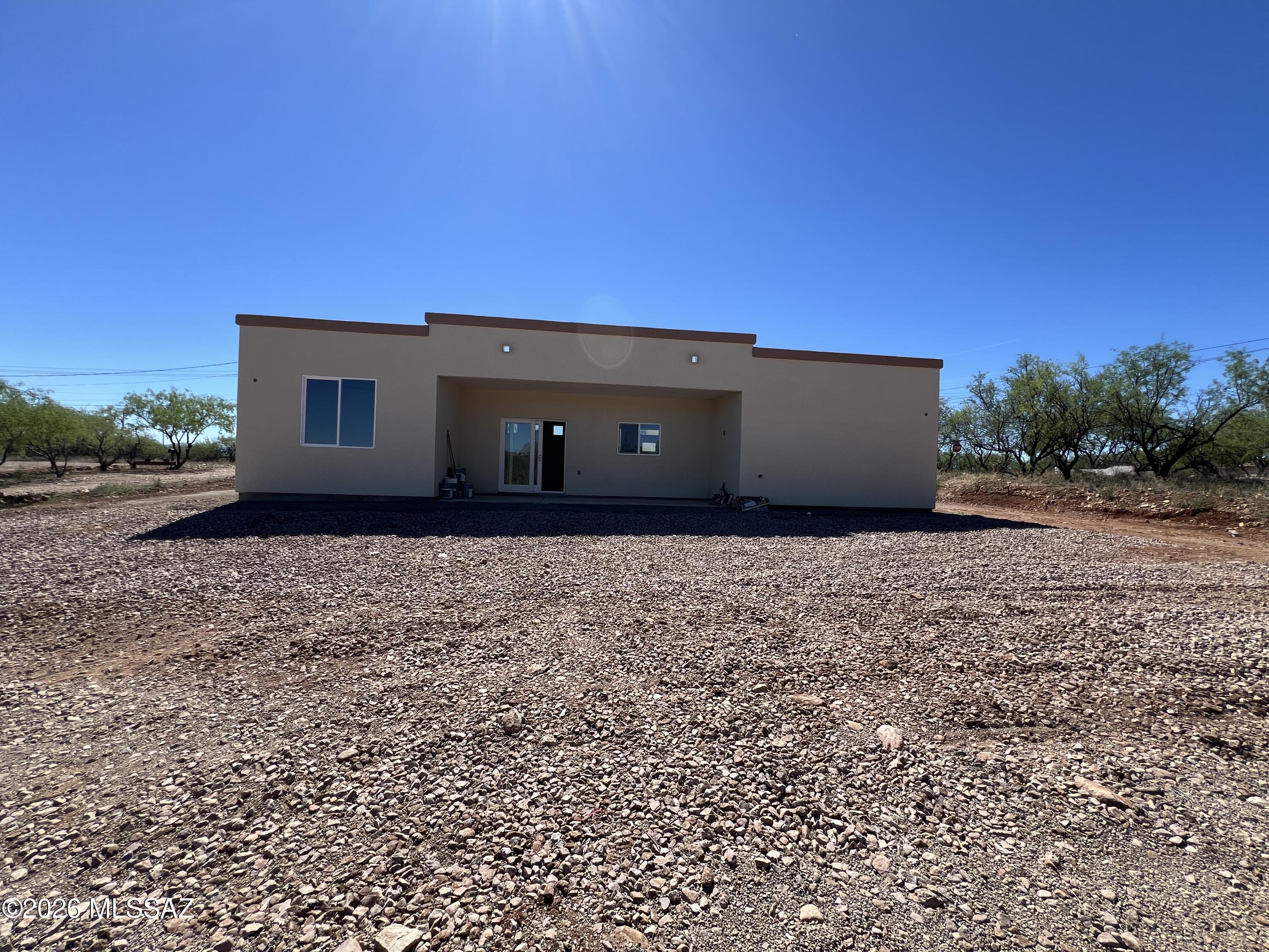 1501 Circulo Sombrero Rio Rico, AZ 85648 - Photo 23 of 26 a front view of a house with a yard