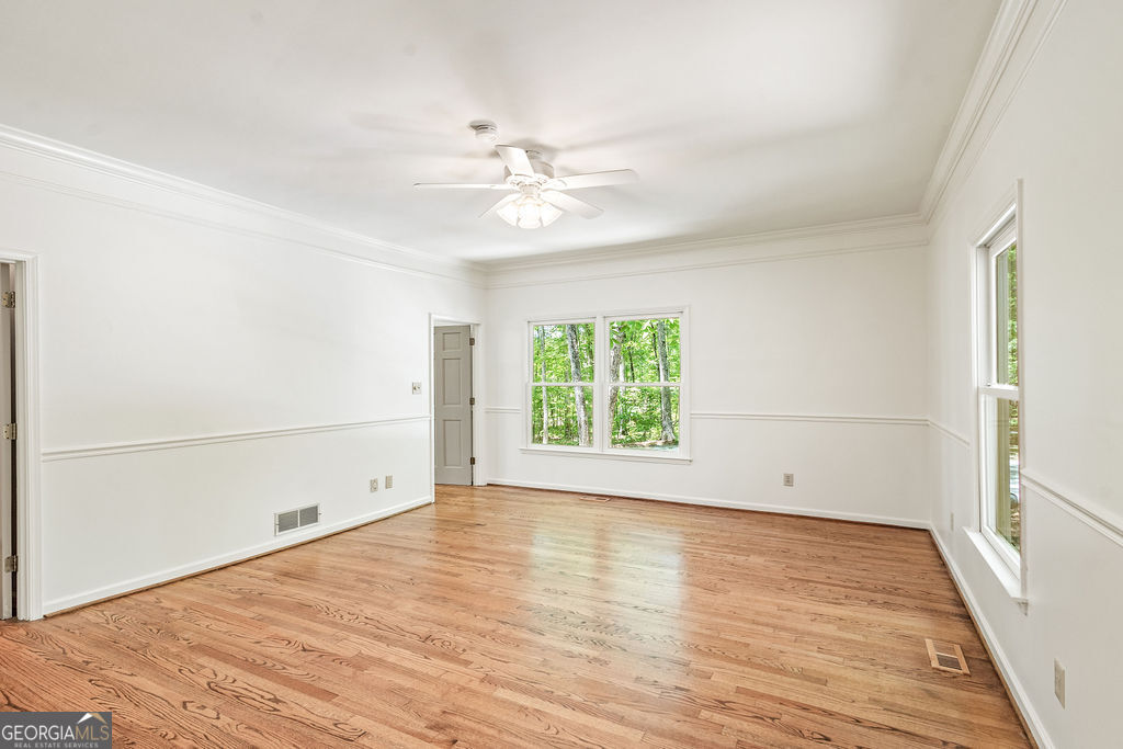230 Haynes Road Moreland, GA 30259 - Photo 23 of 38 wooden floor in an empty room with a window