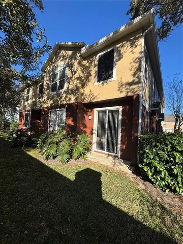 a view of a swimming pool with a yard
