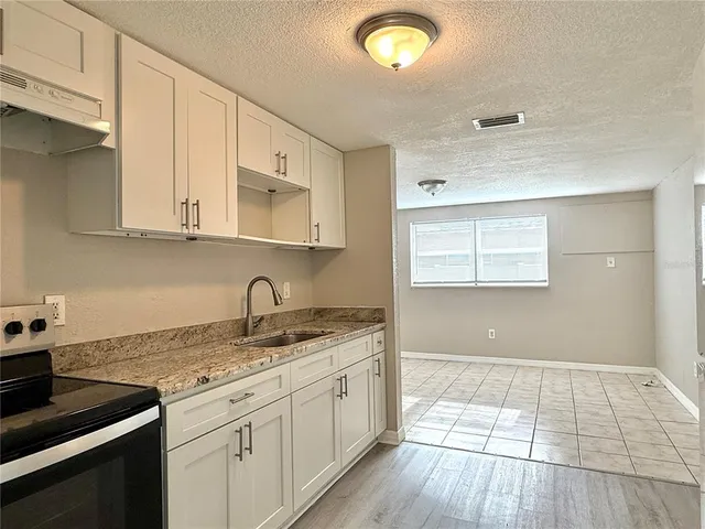 a backyard of a house with wooden fence