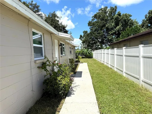 a view of a backyard with potted plants