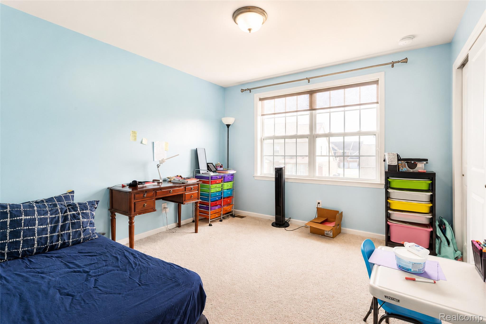 50873 Scarborough Road Canton, MI 48188 - Photo 19 of 33 Carpeted room featuring light blue walls and a large window with white muntins