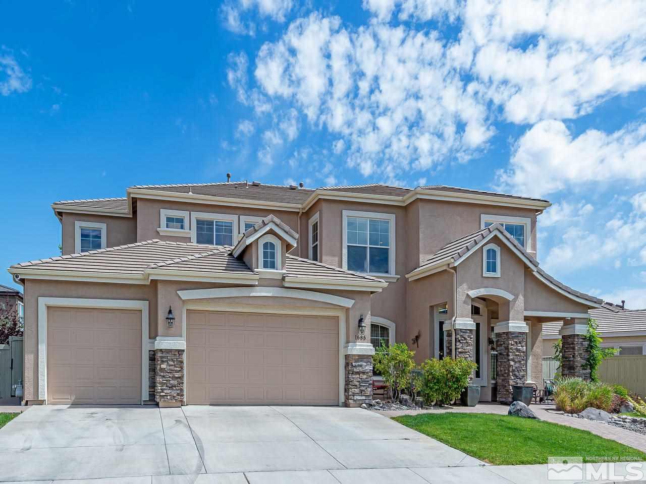 1685 Silver Thread Drive Reno, NV 89521 - Photo 3 of 40 a front view of a house with garden