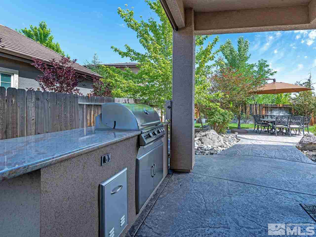 1685 Silver Thread Drive Reno, NV 89521 - Photo 8 of 40 a view of backyard with outdoor seating and plants