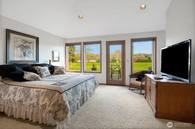 a living room with stainless steel appliances kitchen island granite countertop furniture and a large window