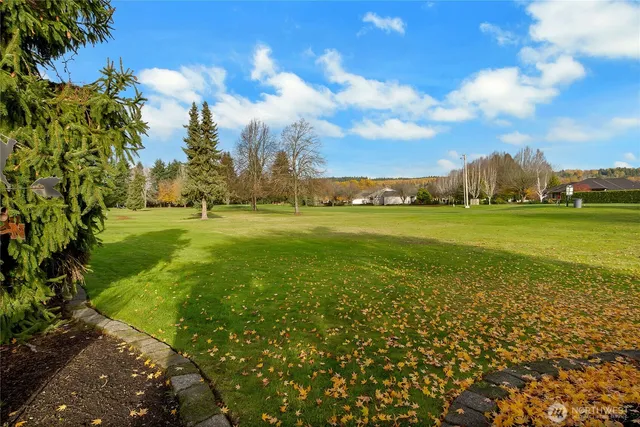 an aerial view of a house with outdoor space and outdoor seating