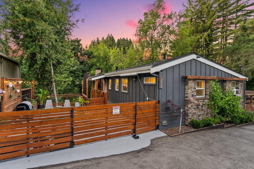 125 Shadowbrook Road Ben Lomond, CA 95005 - Photo 1 of 60 a front view of a house with garden