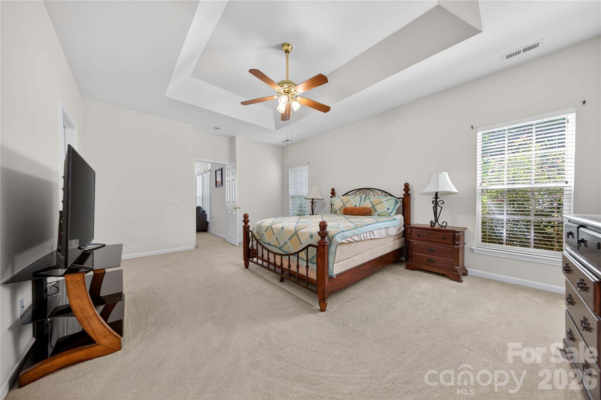 533 Fair Oaks Drive Fort Mill, SC 29708 - Photo 17 of 33 a bedroom with bed and a flat tv screen on dresser