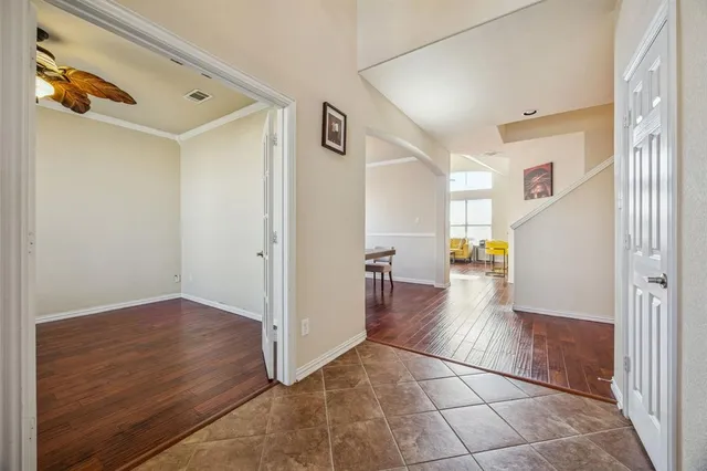 a view of a hallway view with wooden floor and staircase