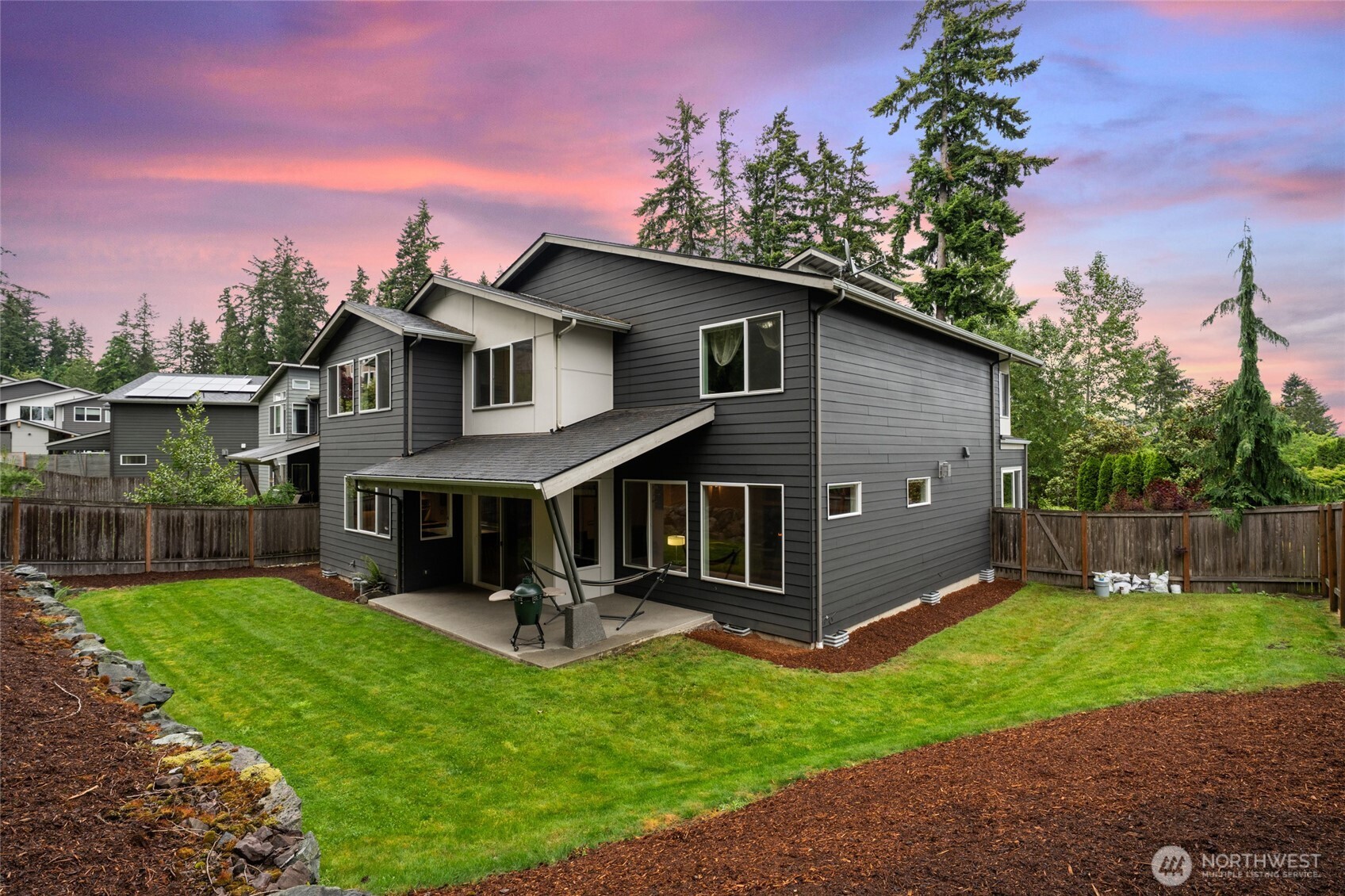 22326 2nd Place Southeast Bothell, WA 98021 - Photo 34 of 40 a view of a house with a yard and a garden