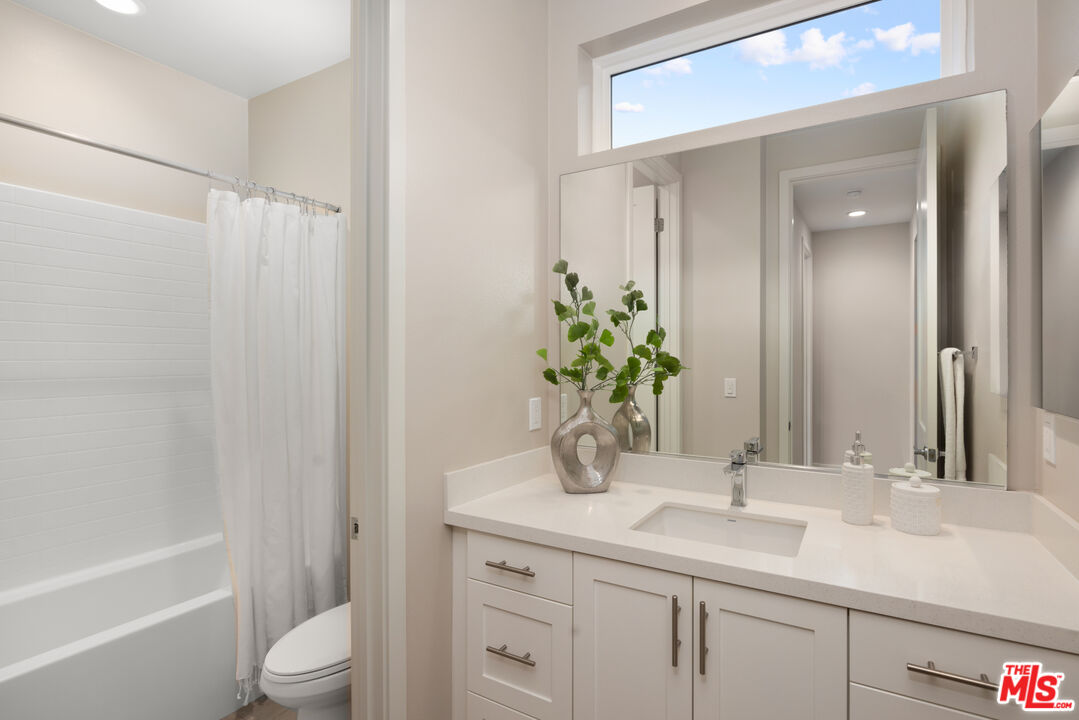 386 Novel Irvine, CA 92618 - Photo 19 of 52 a bathroom with a sink a toilet and shower