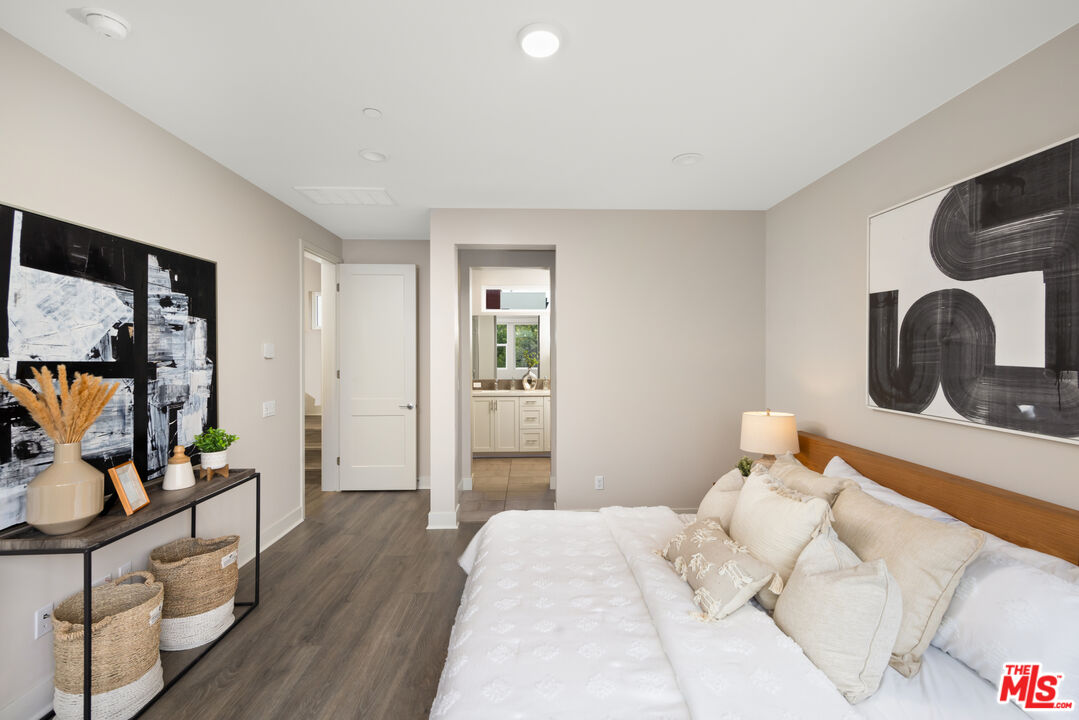 386 Novel Irvine, CA 92618 - Photo 23 of 52 a bedroom with bed and wooden floor