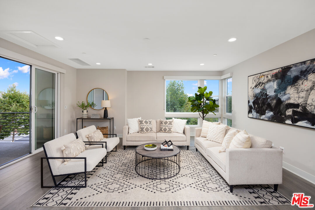 386 Novel Irvine, CA 92618 - Photo 28 of 52 a living room with furniture and a large window