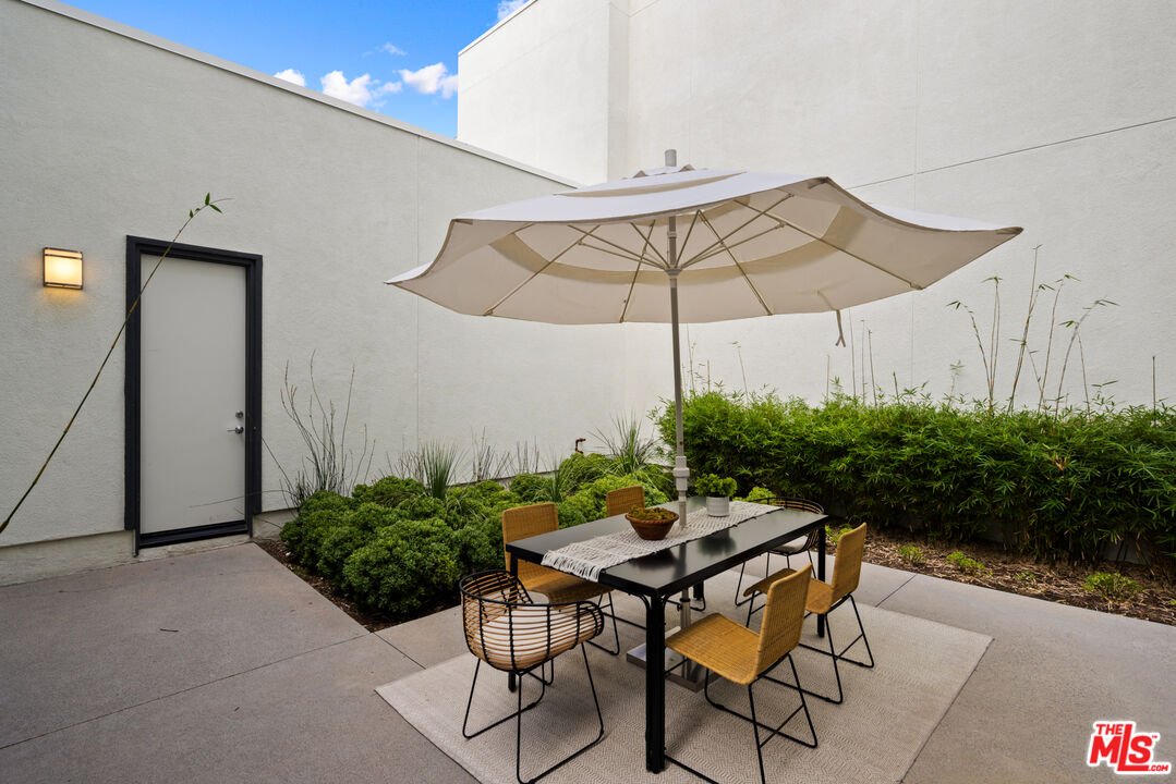386 Novel Irvine, CA 92618 - Photo 35 of 52 a patio with a patio table and chairs