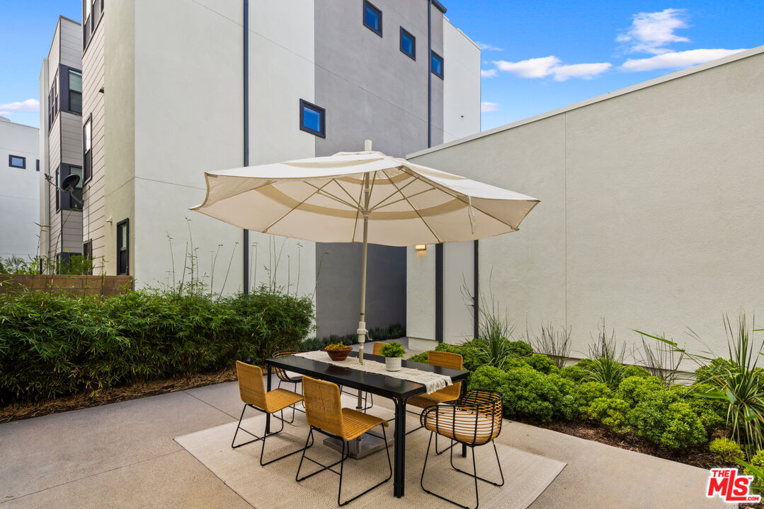 386 Novel Irvine, CA 92618 - Photo 36 of 52 a table and chairs in patio of a house