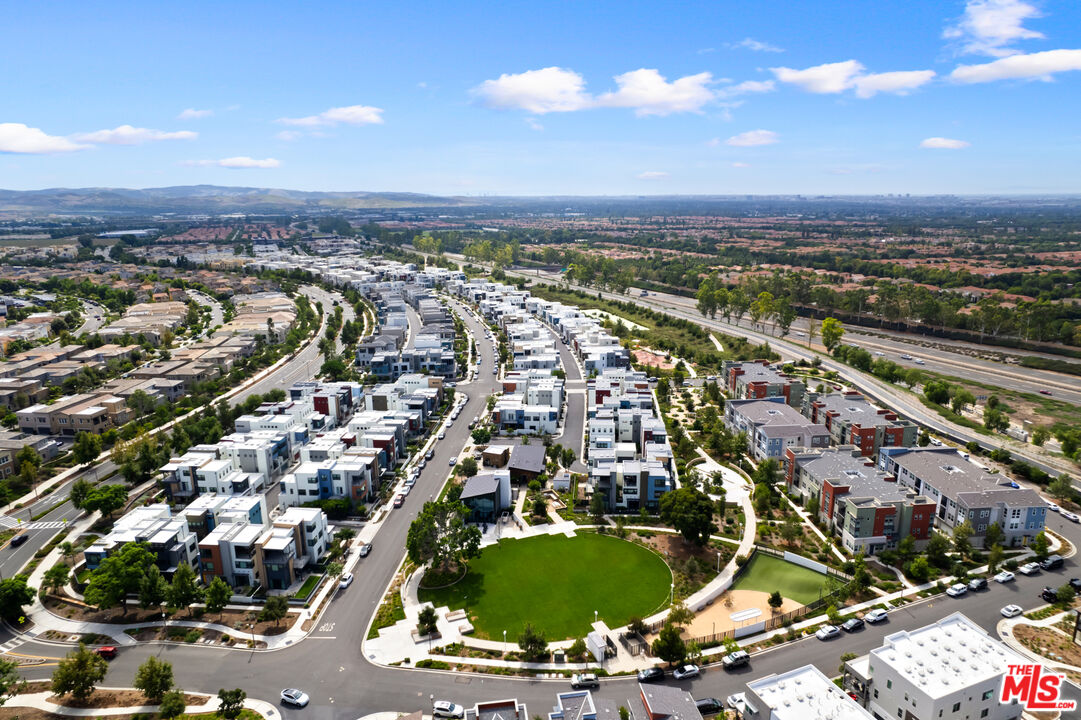 386 Novel Irvine, CA 92618 - Photo 47 of 52 an aerial view of residential building with parking space