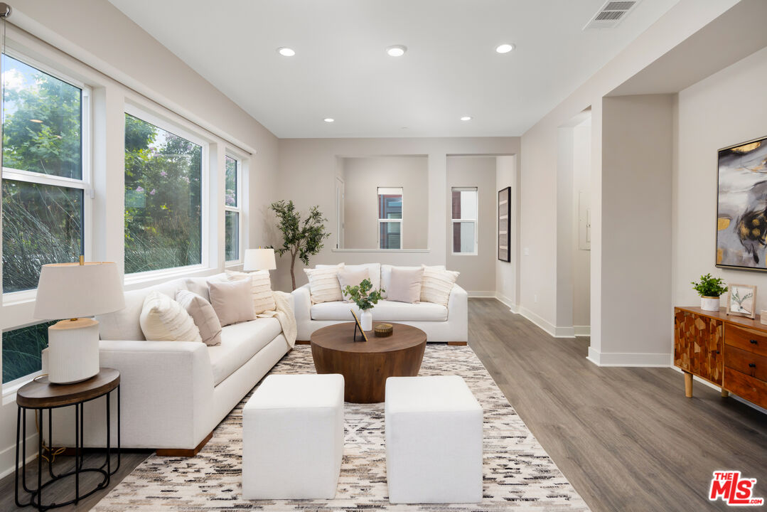 386 Novel Irvine, CA 92618 - Photo 5 of 52 a living room with furniture and wooden floor