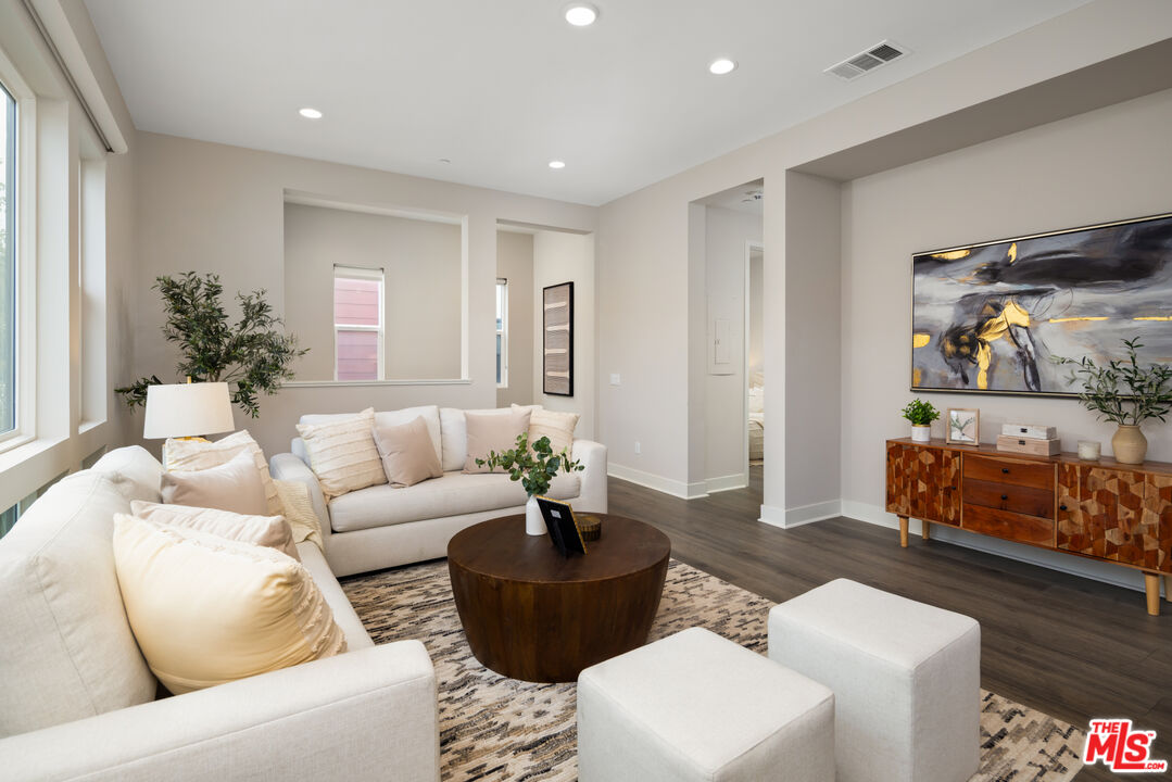 386 Novel Irvine, CA 92618 - Photo 6 of 52 a living room with furniture and a potted plant