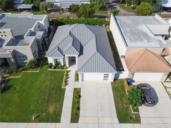 an aerial view of a house with a garden