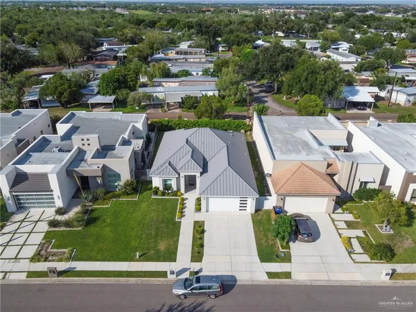 an aerial view of a house with a garden and plants