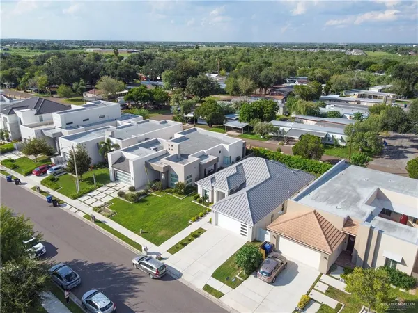 an aerial view of residential houses with outdoor space