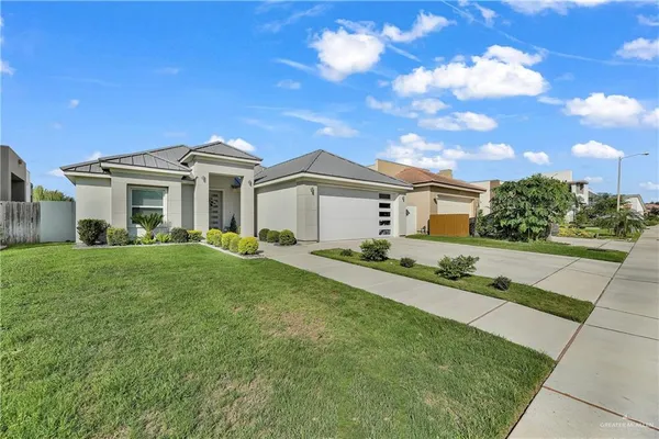 a front view of a house with a yard