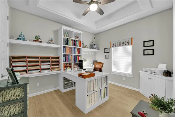 a room with furniture a chandelier and a window