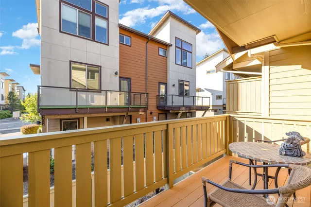 a view of a patio with couches and potted plants