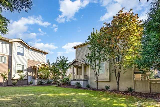 a front view of house with a garden
