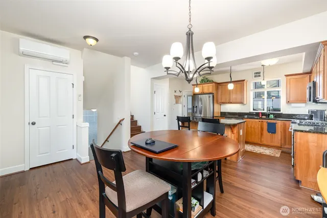 a view of a dining room with furniture window and wooden floor