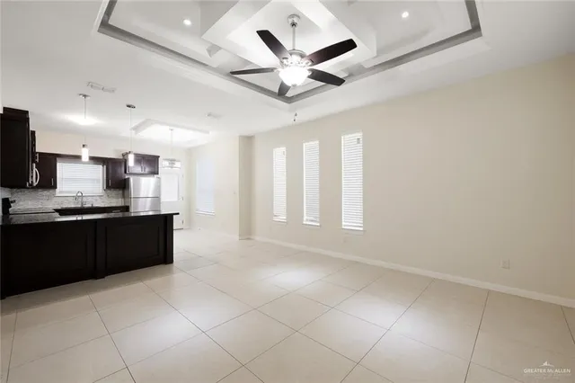 a kitchen with stainless steel appliances granite countertop a stove and a microwave oven