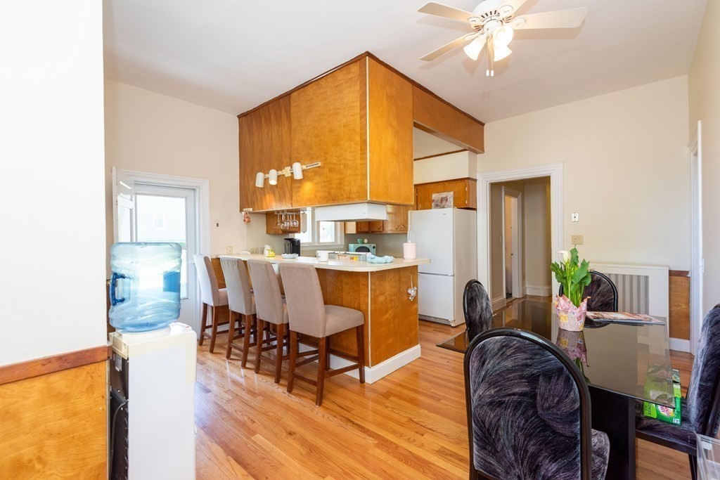 30 Chestnut Street Stoneham, MA 02180 - Photo 11 of 41 a dining room with furniture a window and wooden floor