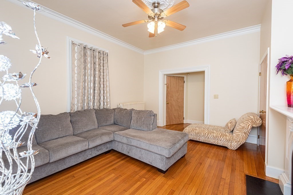 30 Chestnut Street Stoneham, MA 02180 - Photo 16 of 41 a living room with furniture and a wooden floor