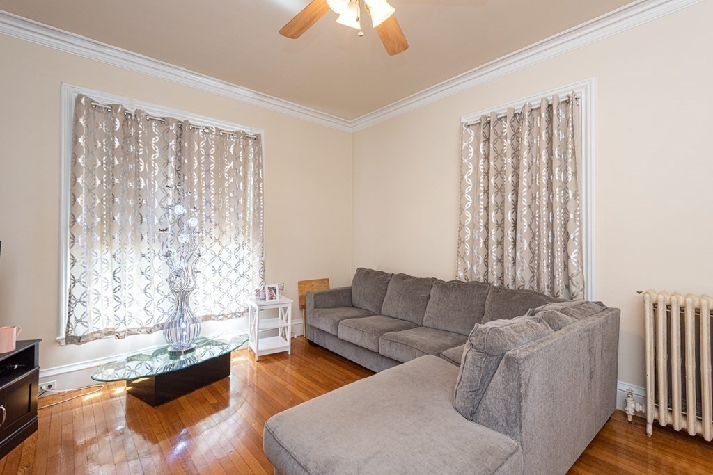 30 Chestnut Street Stoneham, MA 02180 - Photo 17 of 41 a living room with furniture and a large window