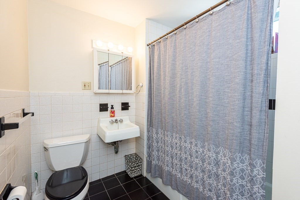 30 Chestnut Street Stoneham, MA 02180 - Photo 18 of 41 a bathroom with a sink toilet and shower