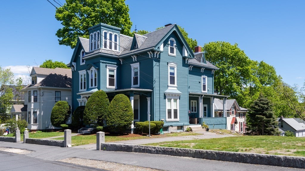 30 Chestnut Street Stoneham, MA 02180 - Photo 2 of 41 a front view of a house with garden and plants