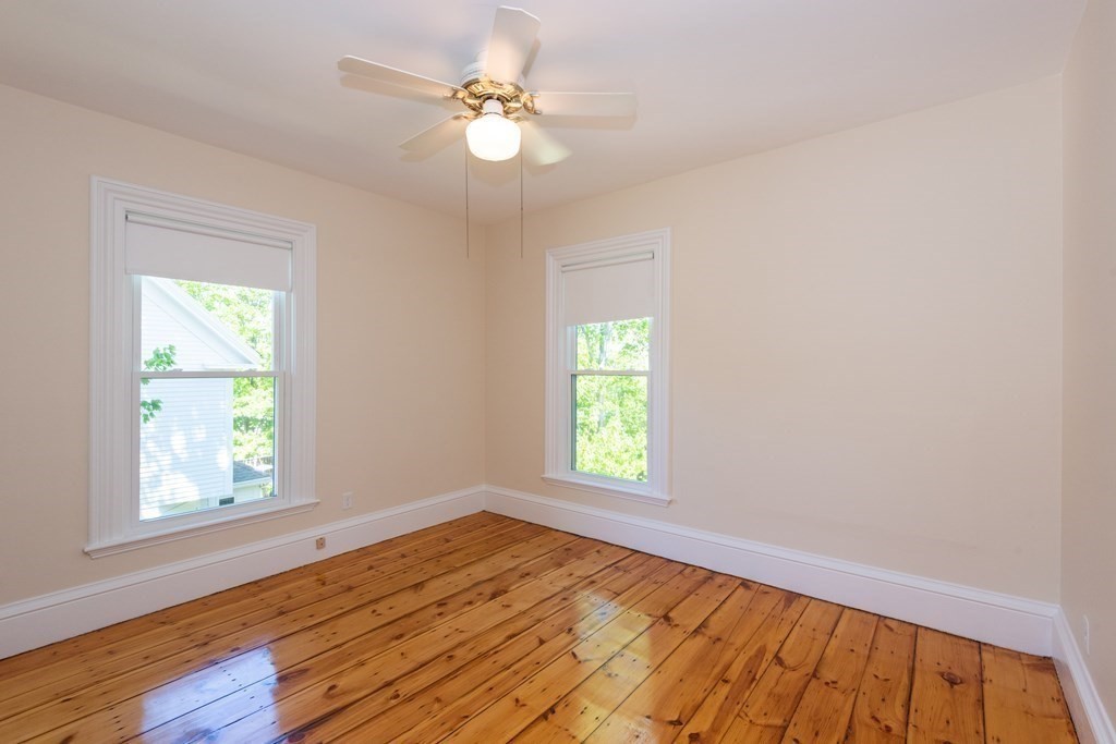 30 Chestnut Street Stoneham, MA 02180 - Photo 29 of 41 wooden floor in an empty room with a window