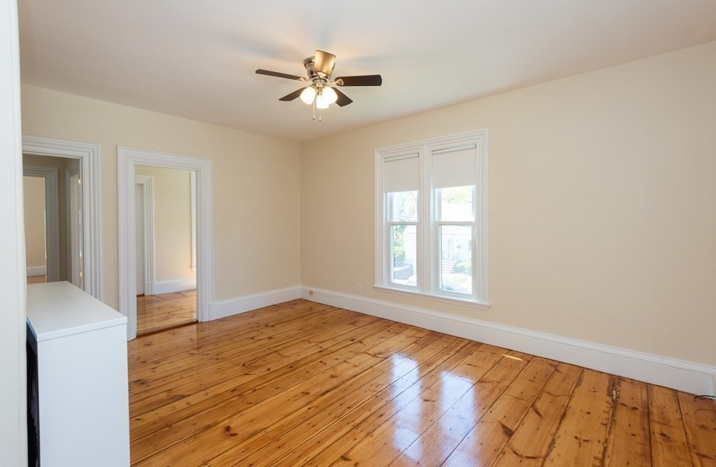 30 Chestnut Street Stoneham, MA 02180 - Photo 31 of 41 a view of empty room with wooden floor and fan