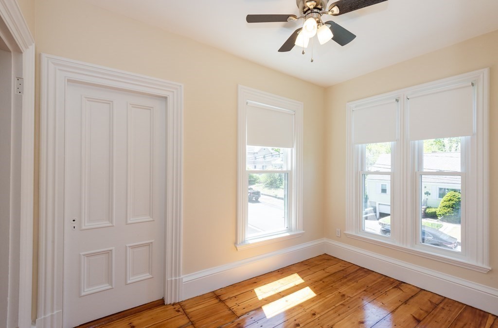 30 Chestnut Street Stoneham, MA 02180 - Photo 33 of 41 a view of an empty room with wooden floor and a window