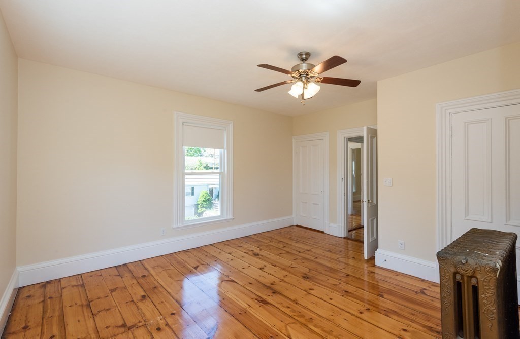 30 Chestnut Street Stoneham, MA 02180 - Photo 35 of 41 a view of empty room with wooden floor and fan