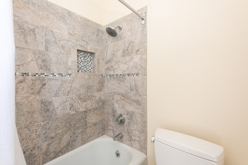 30 Chestnut Street Stoneham, MA 02180 - Photo 37 of 41 a bathroom with a bathtub and a toilet