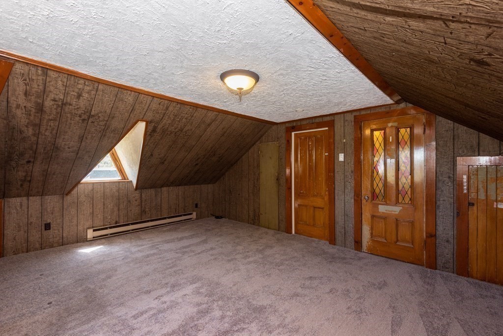 30 Chestnut Street Stoneham, MA 02180 - Photo 40 of 41 a view of an empty room with wooden walls