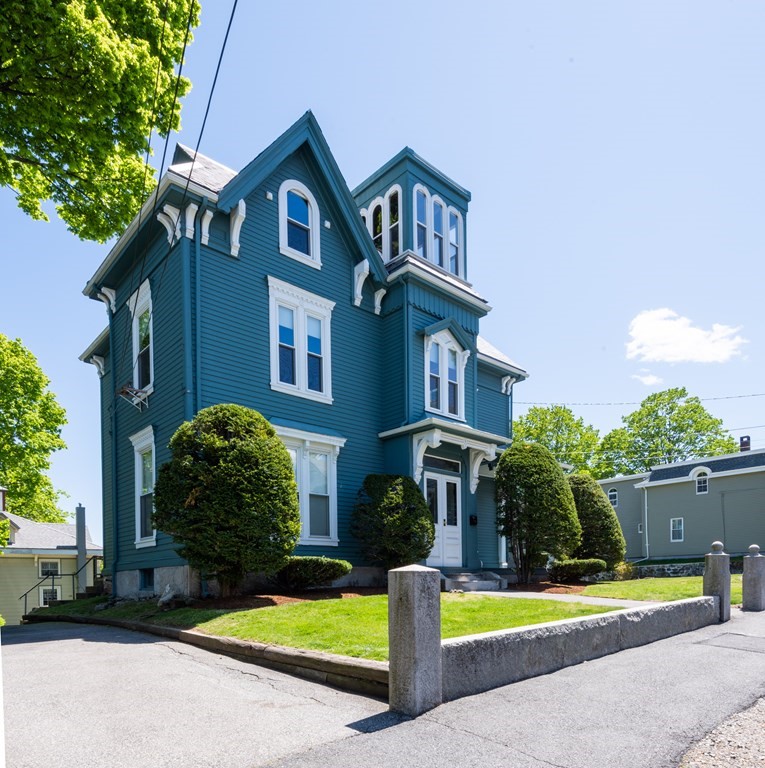 30 Chestnut Street Stoneham, MA 02180 - Photo 4 of 41 a front view of a house with garden