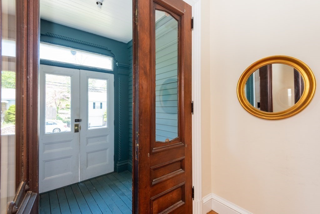 30 Chestnut Street Stoneham, MA 02180 - Photo 6 of 41 a view of a room with wooden floor and windows
