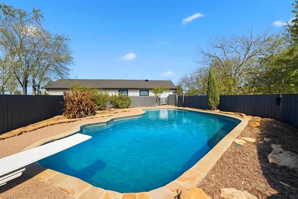3873 Lois Road East Sanger, TX 76266 - Photo 2 of 40 Exterior swimming pool with fence surround and private!