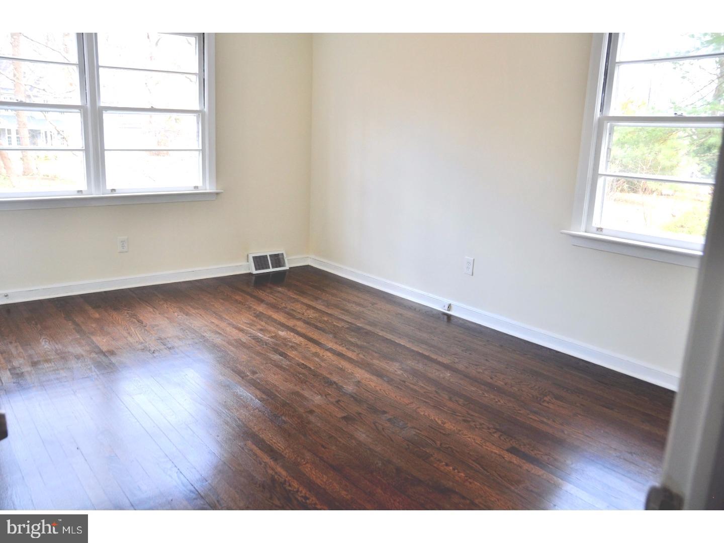 591 Farnum Road Media, PA 19063 - Photo 14 of 21 a view of an empty room with wooden floor and a window