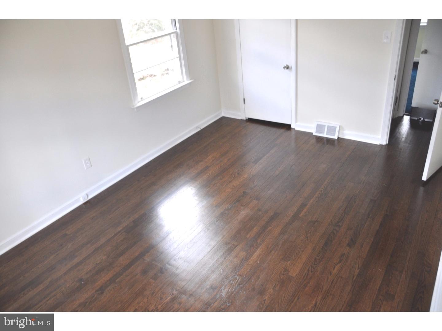 591 Farnum Road Media, PA 19063 - Photo 15 of 21 a view of an empty room with wooden floor and a window