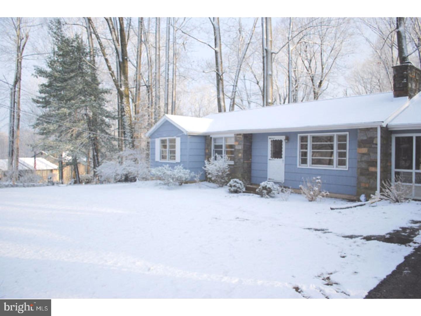 591 Farnum Road Media, PA 19063 - Photo 2 of 21 a front view of a house with a yard covered in snow